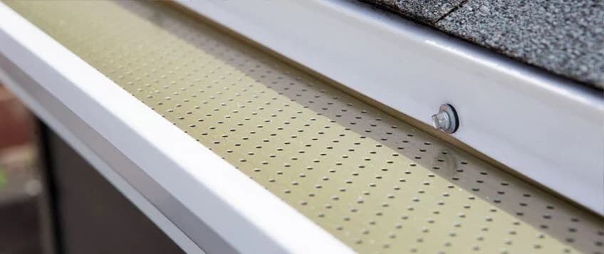 Installed gutter system along residential roofline